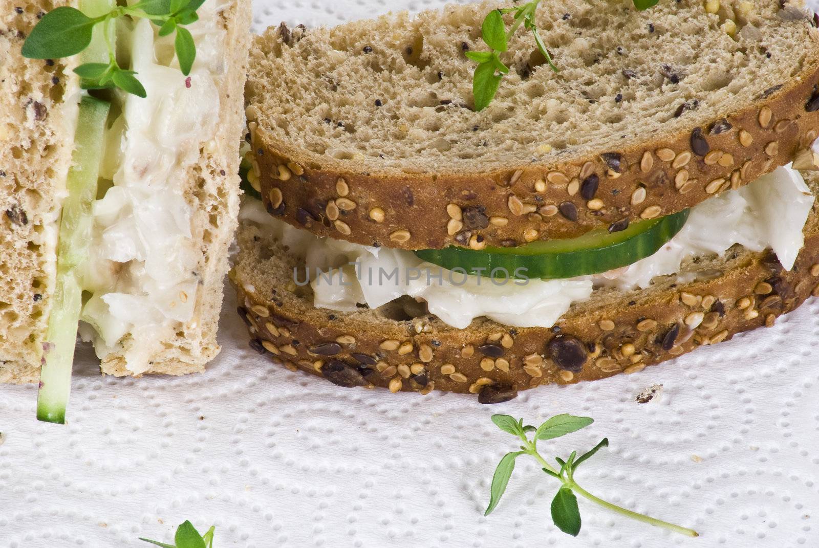 Cucumber and coleslaw sandwich with thyme leaves