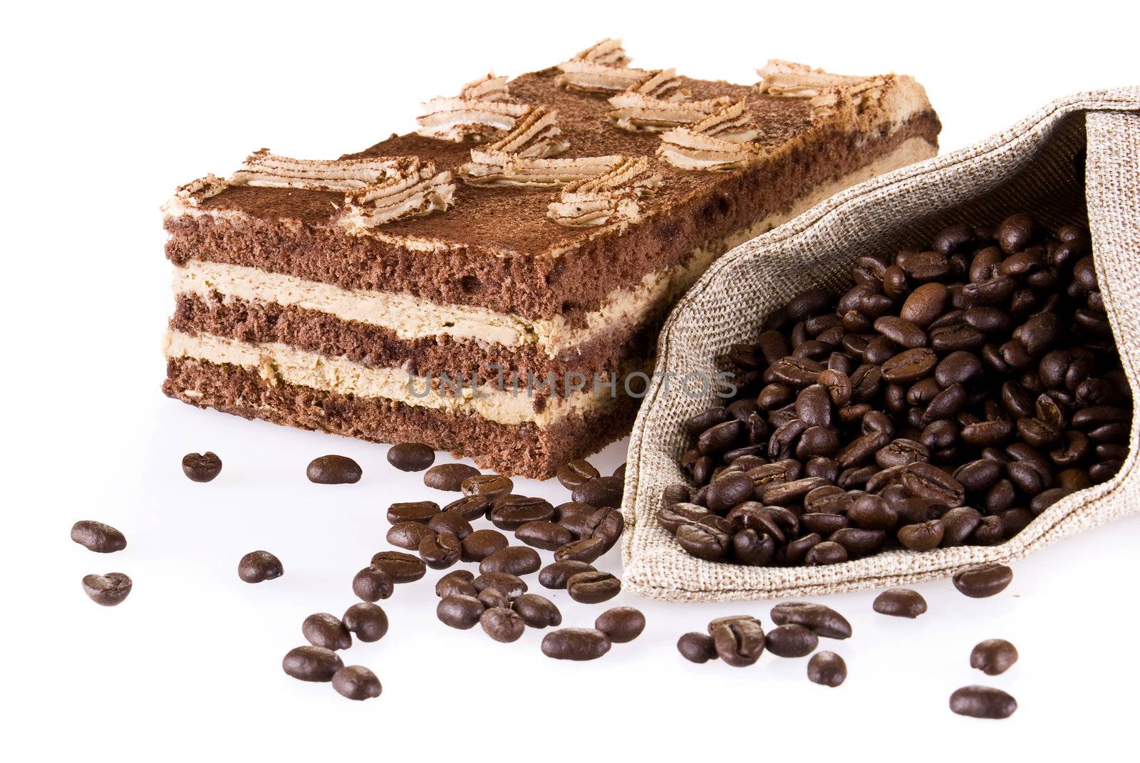 Tiramisu cake with bag of coffe beans isolated over white