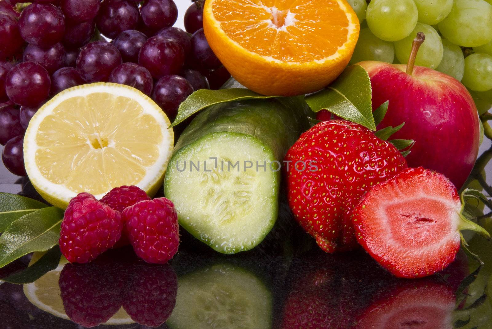 Fruits and cucumber in reflection