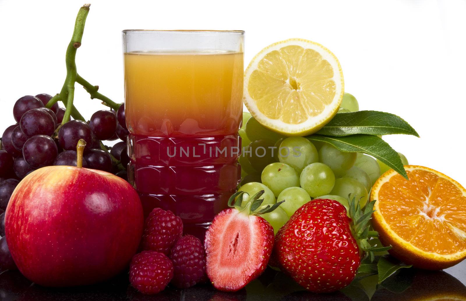 Glass of juice and fruits by caldix