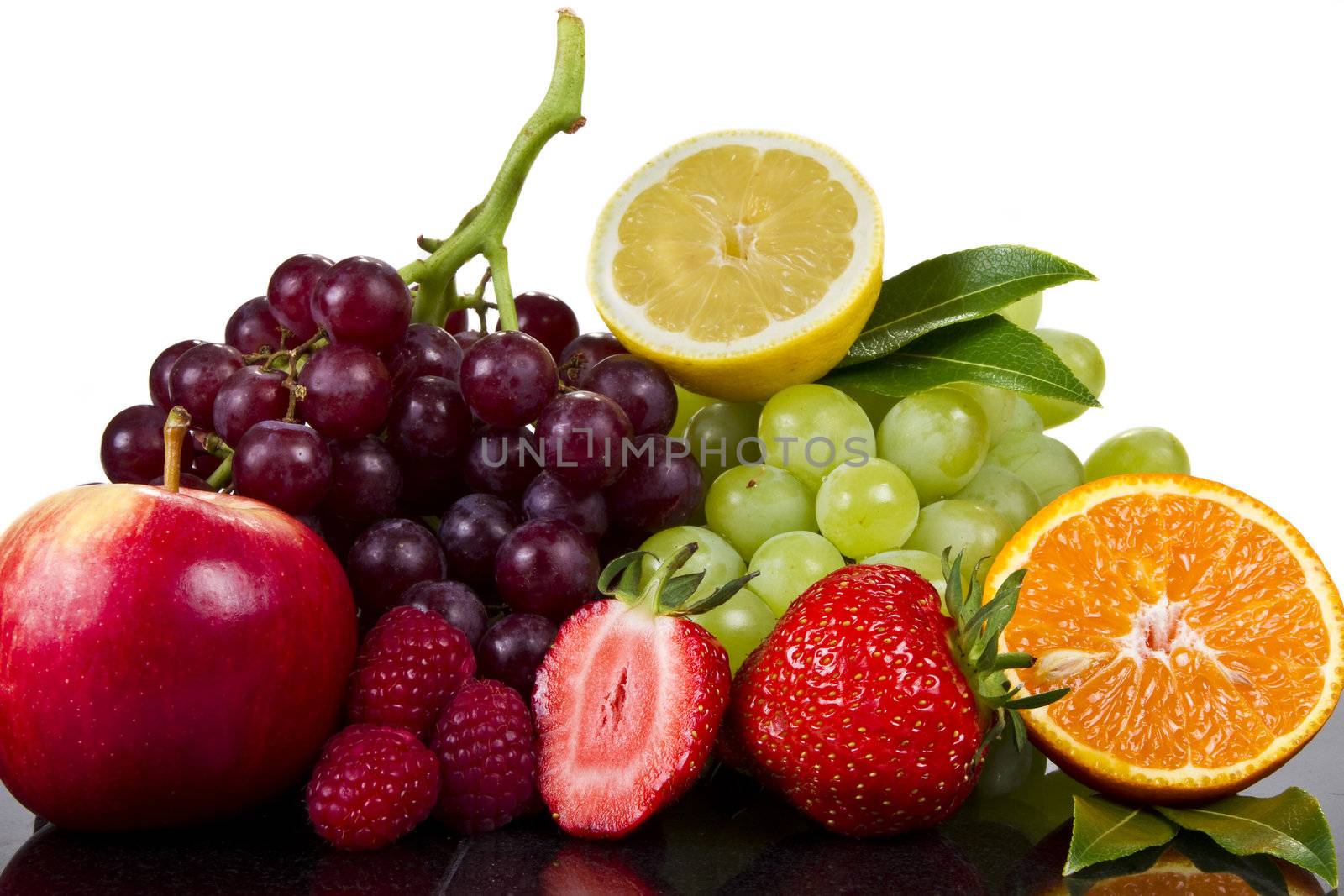 Fresh fruits in reflection isolated over white