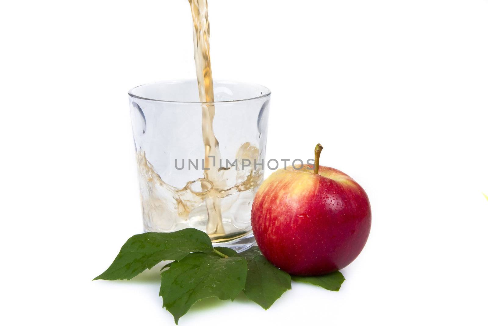 Pouring apple juice - isloated over white