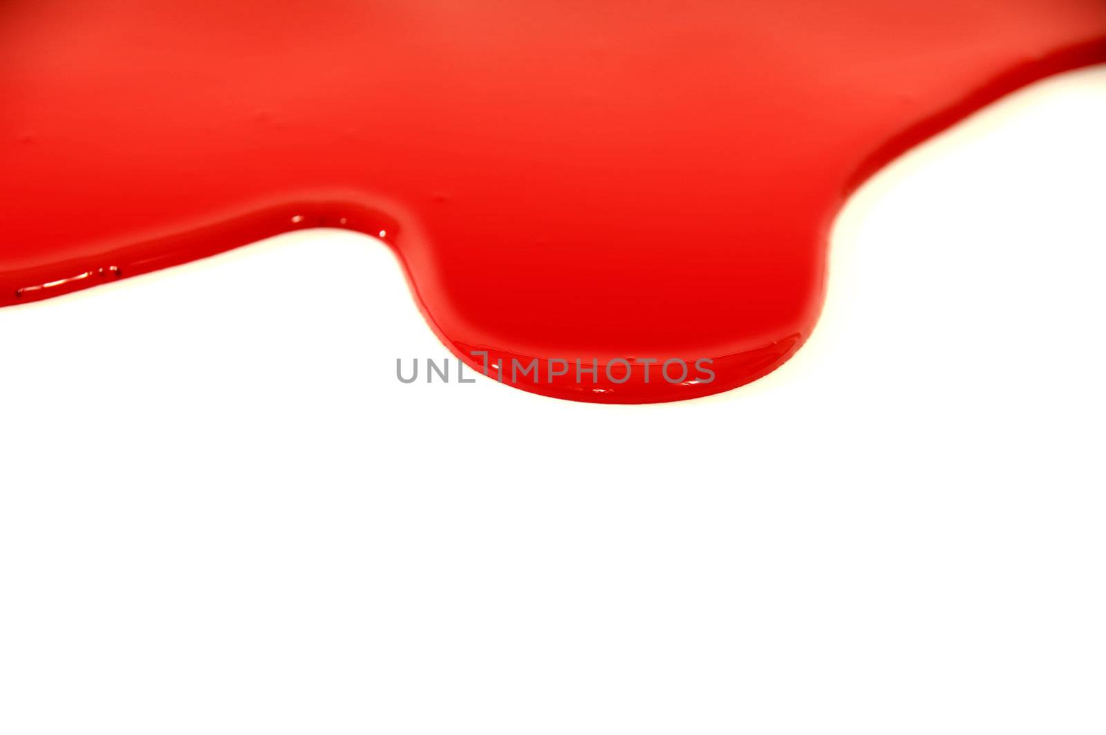 Red paint is flowing down a white background