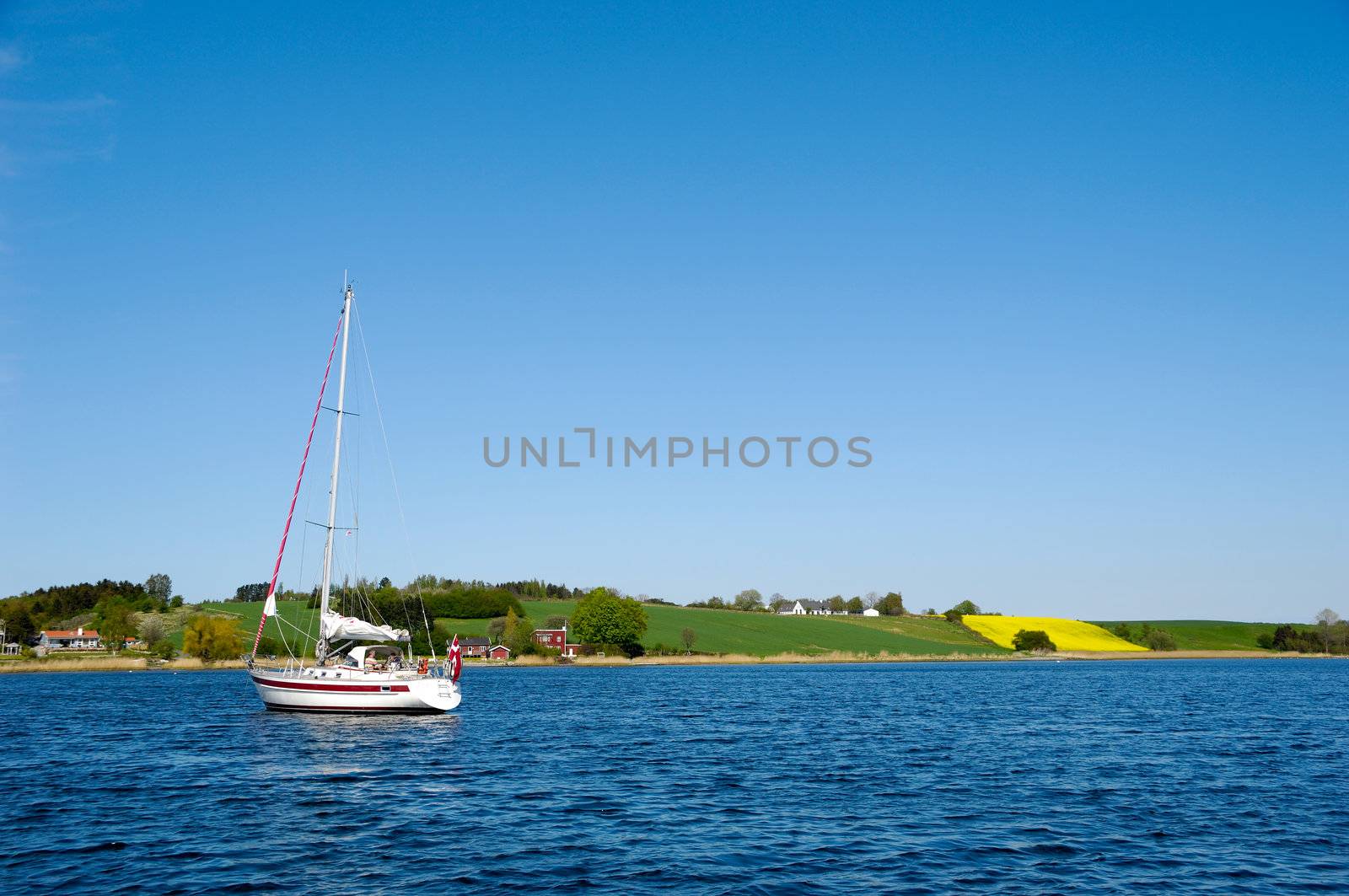 Saliboat at see with view to land