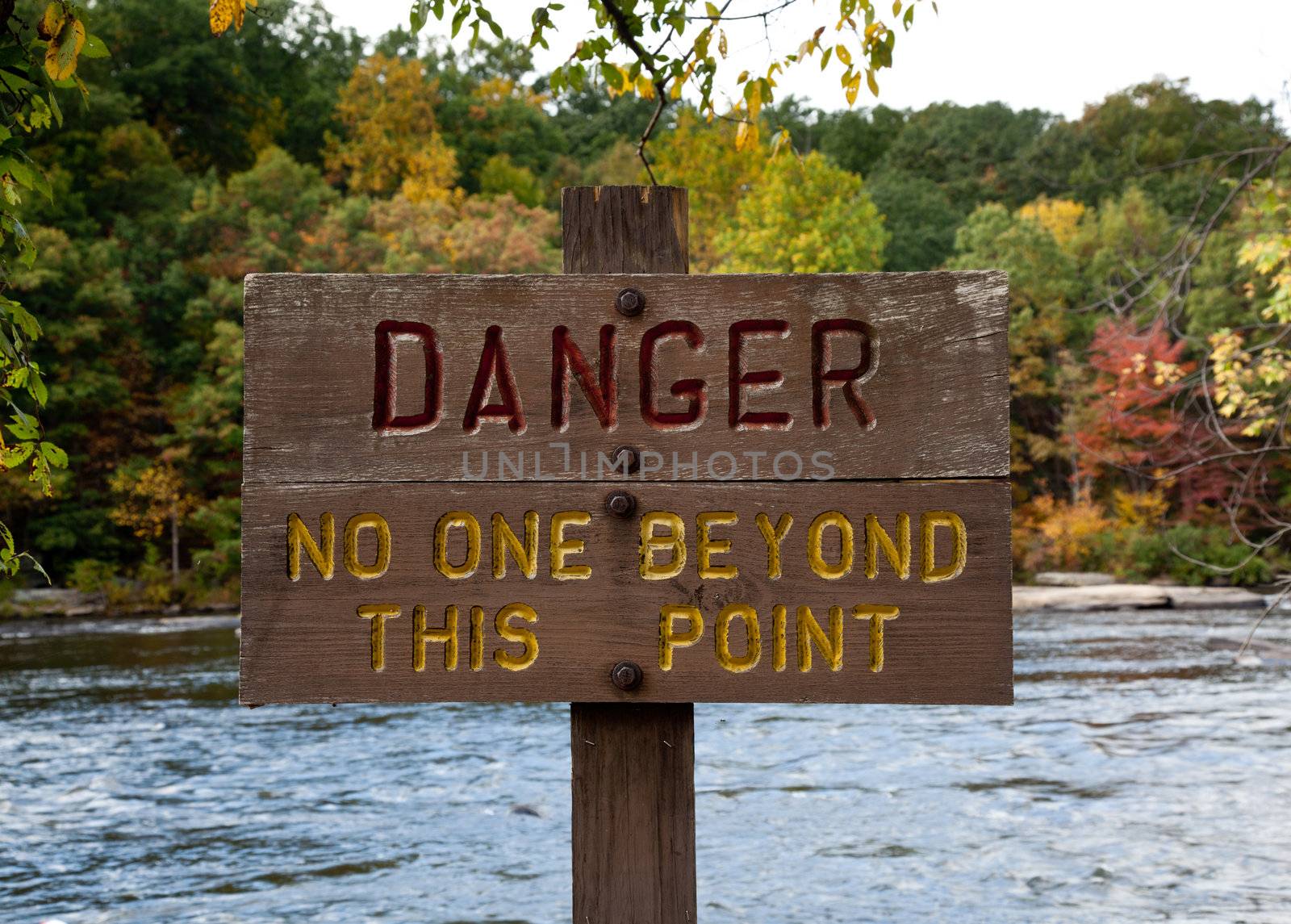 Danger sign by river by steheap
