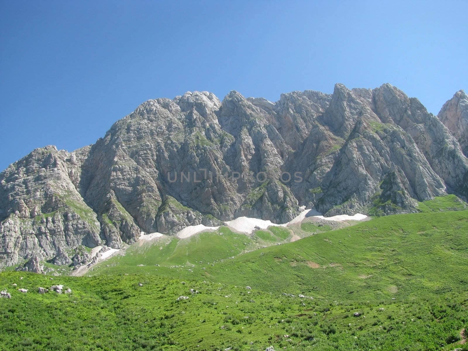 Mountains, rocks; a relief; a landscape; a hill; a panorama; Caucasus; top; a slope; clouds; the sky; a landscape