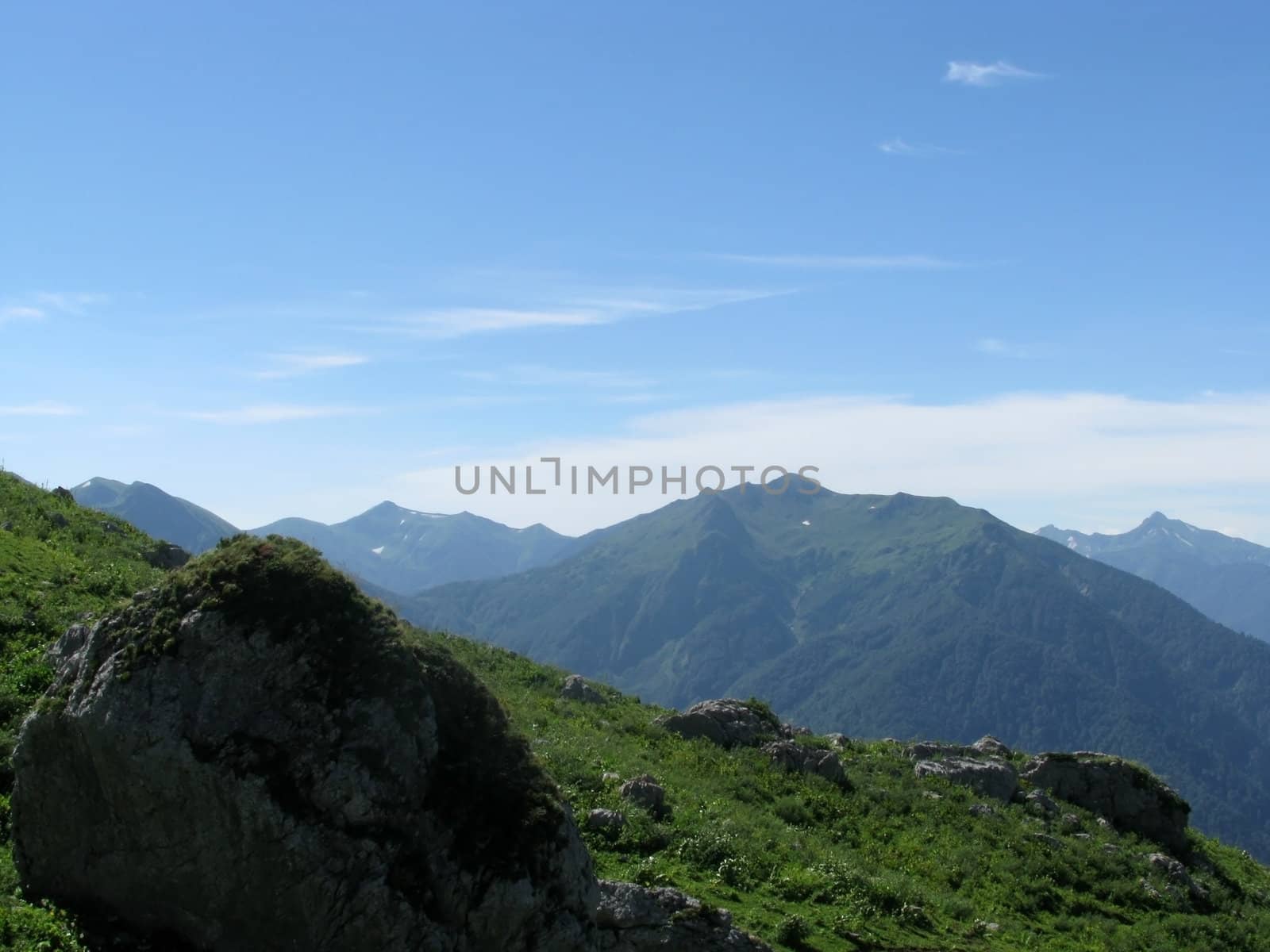 Mountains, rocks; a relief; a landscape; a hill; a panorama; Caucasus; top; a slope; clouds; the sky; a landscape