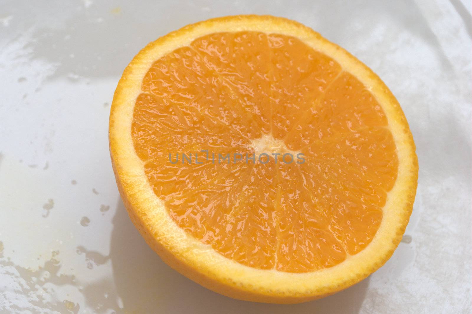 Sliced orange on white plate