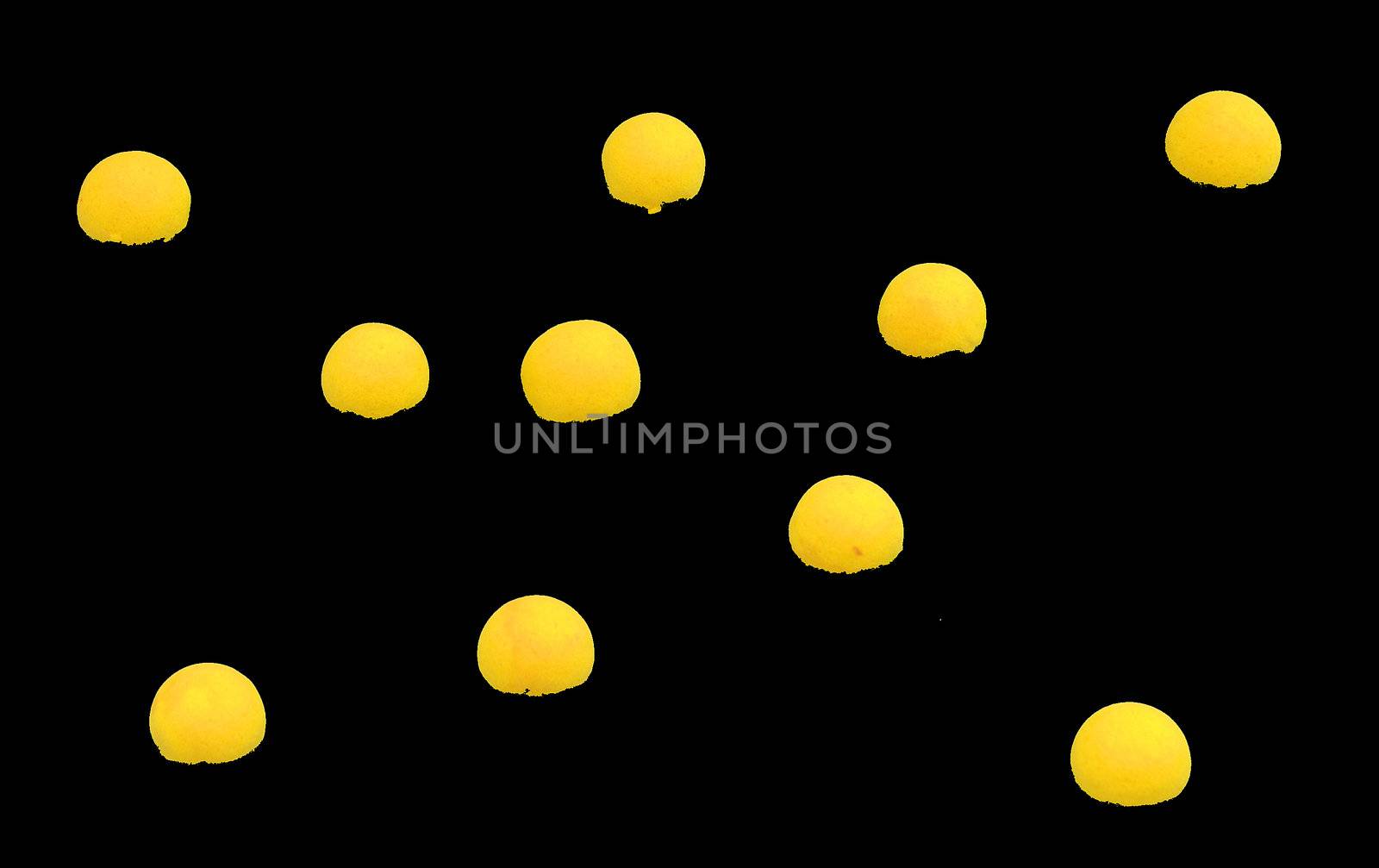 Small number of yellow spheres on black background