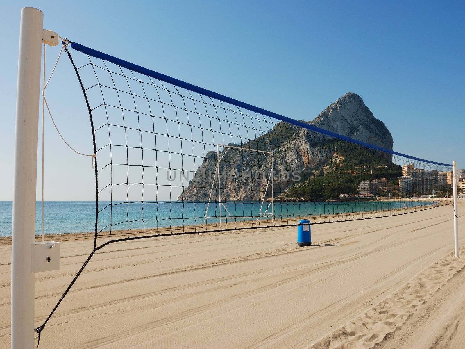 Volleyball net on a sandy mediterranean beach