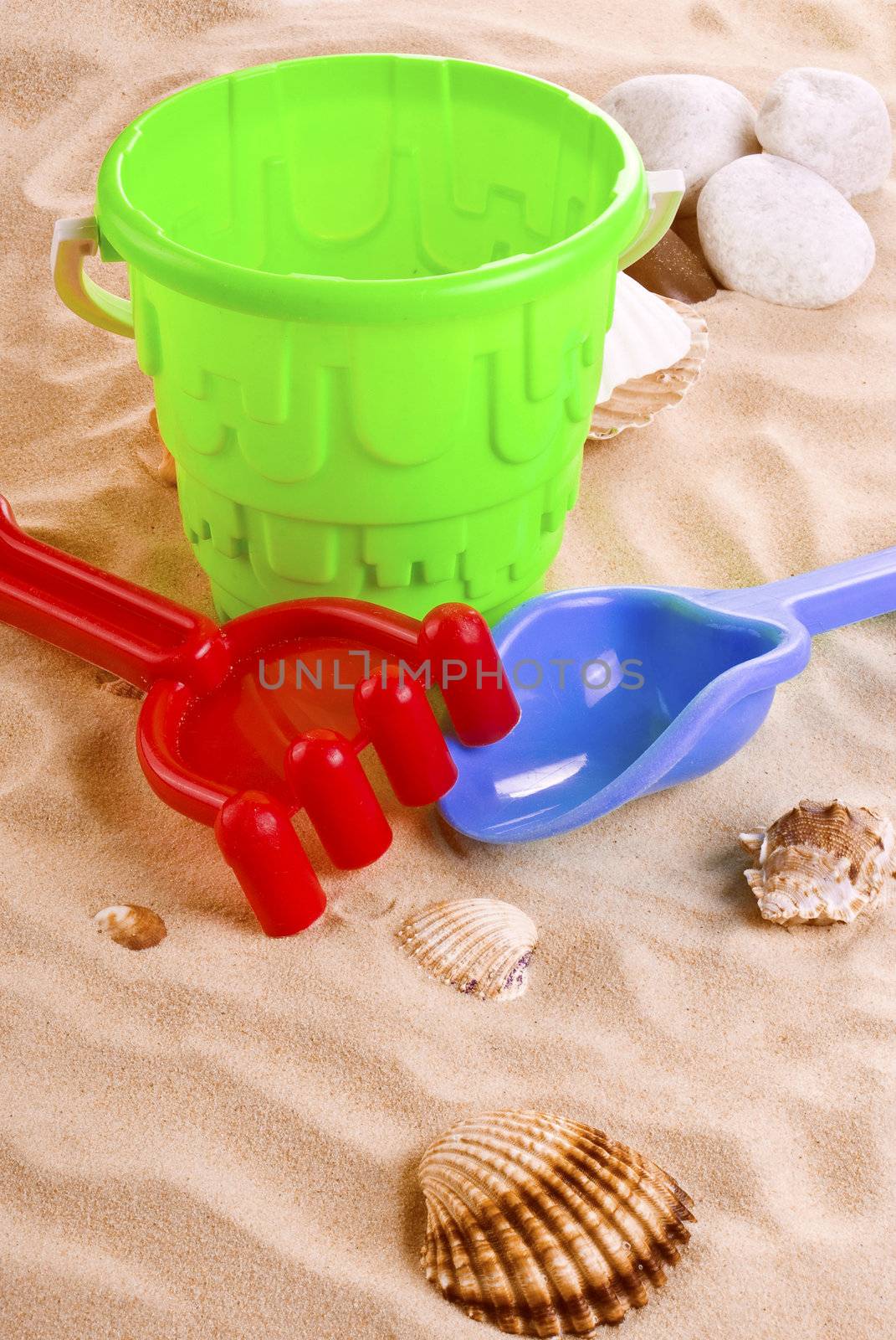 Children's toys -  bucket, spade and shovel on sand