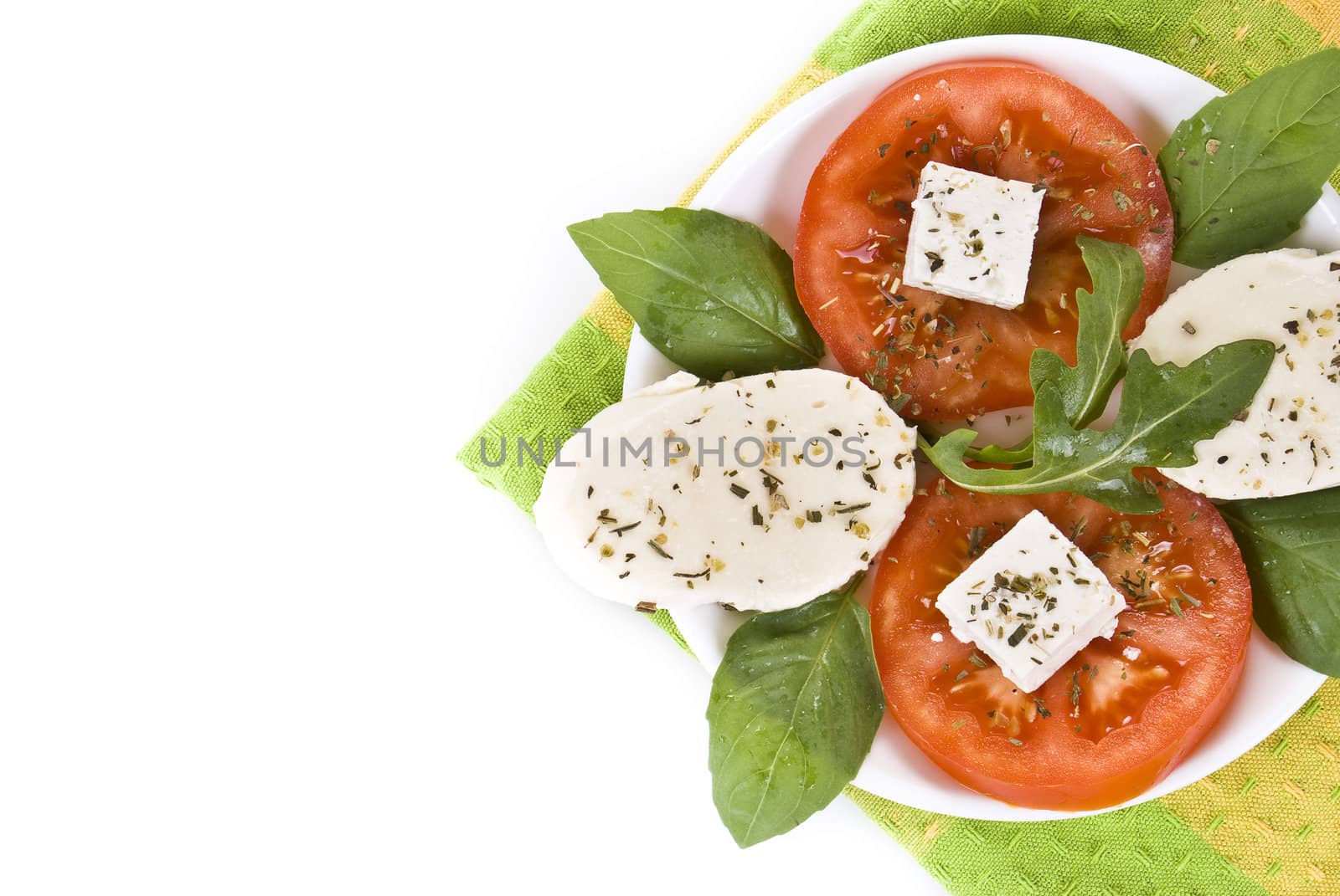 Fresh mozzarella salad over the white background