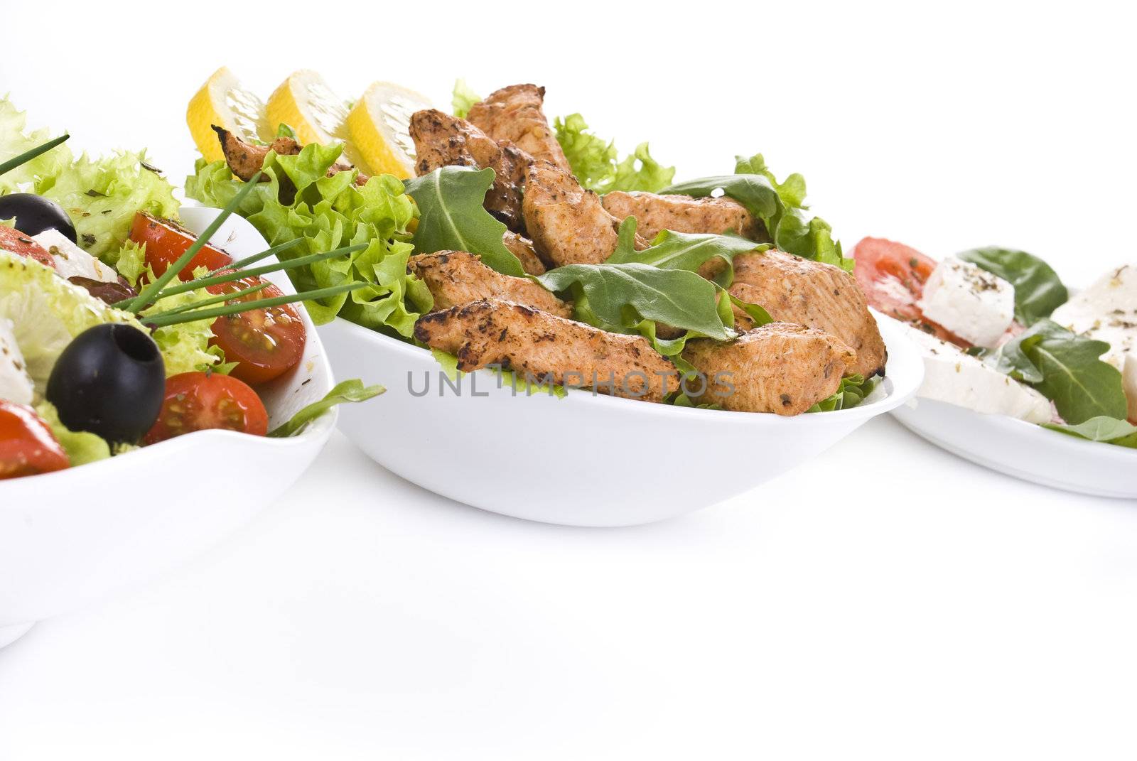 Fresh various salads with focus on chicken salad