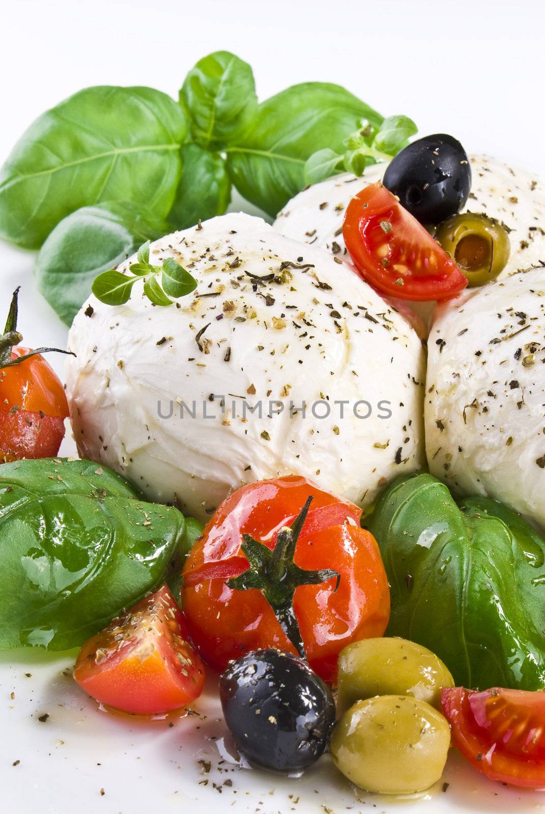 Mozzarella with basil cherry tomatoes and olives by caldix