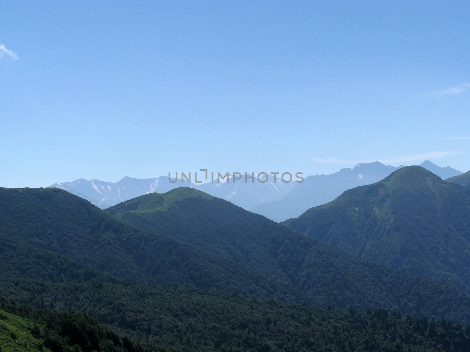 Mountains, rocks; a relief; a landscape; a hill; a panorama; Caucasus; top; a slope; clouds; the sky; a landscape