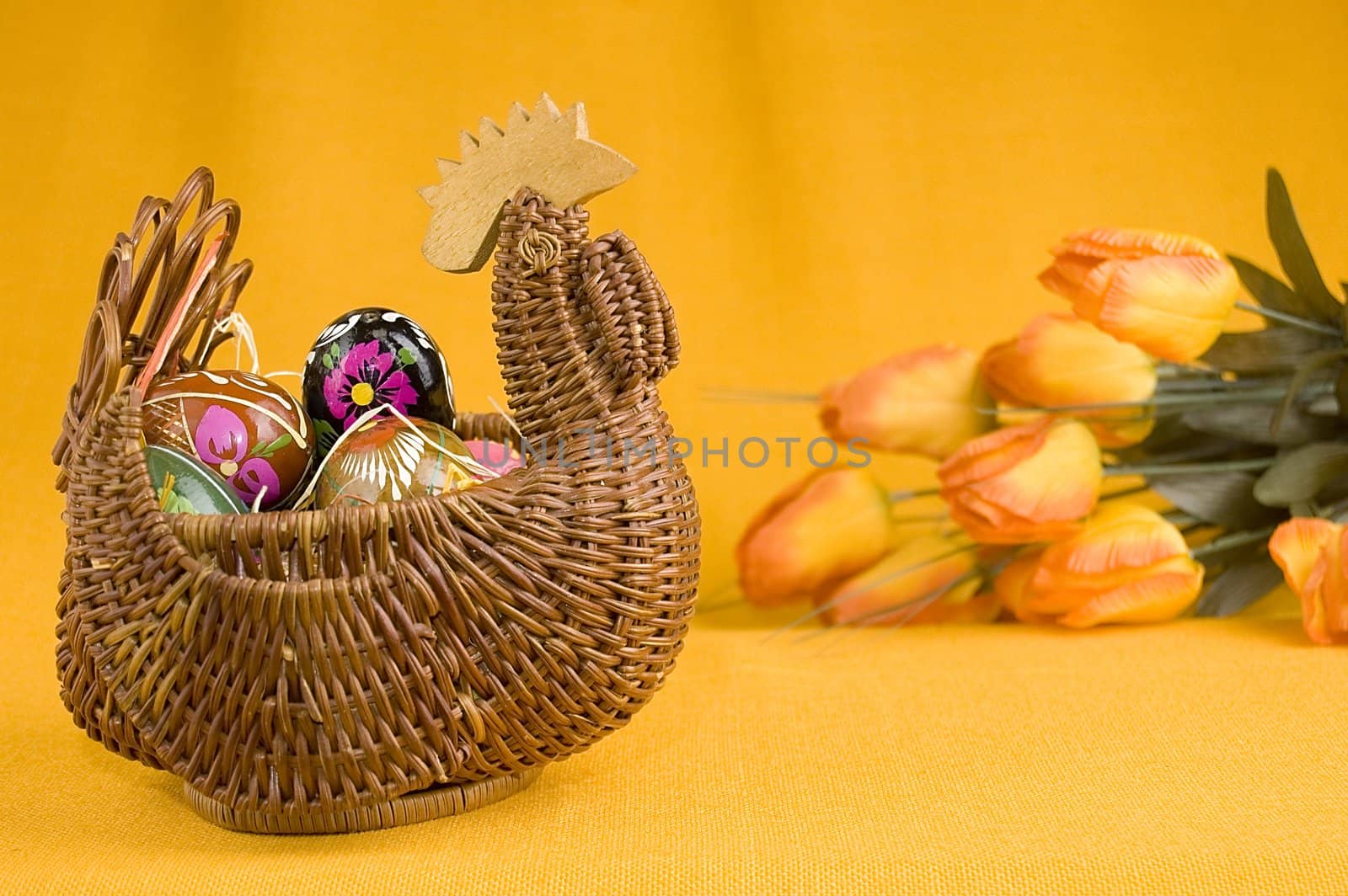 willow hen basket with colorful easter eggs 