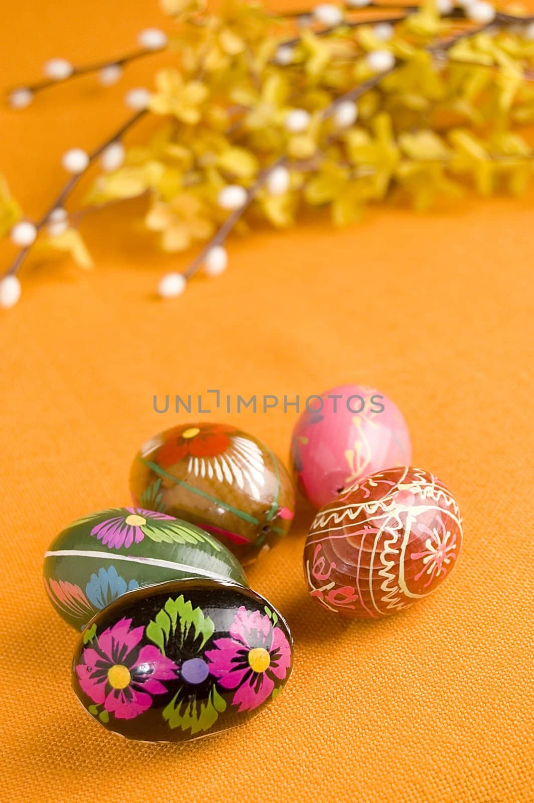 Spring easter eggs over orange background.