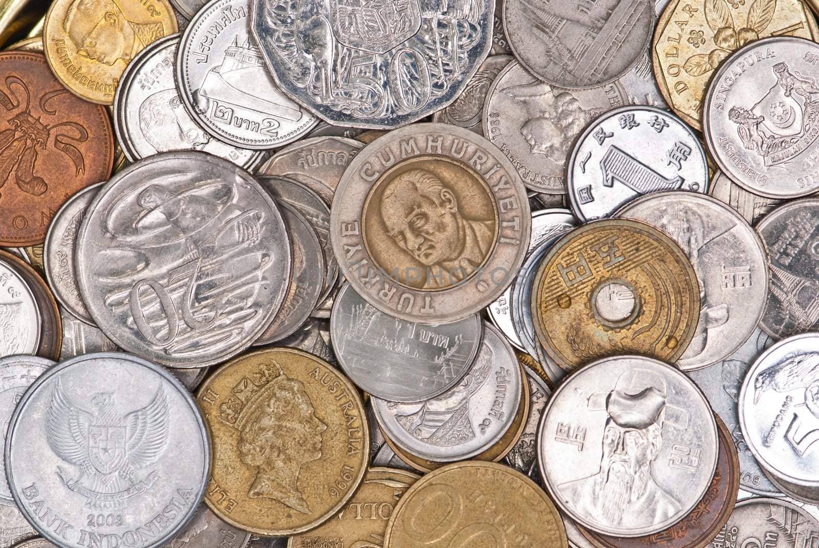 Coins currency from multiple countries, taken from top in isolated background view can be use for financial purposes
