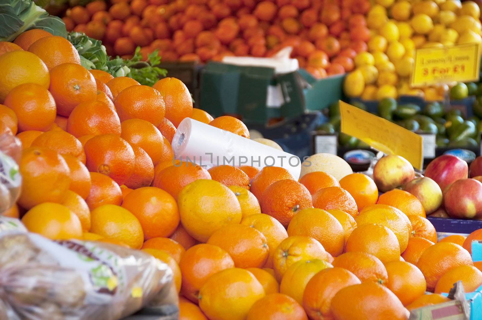 Oranges and other fruits on a market stall