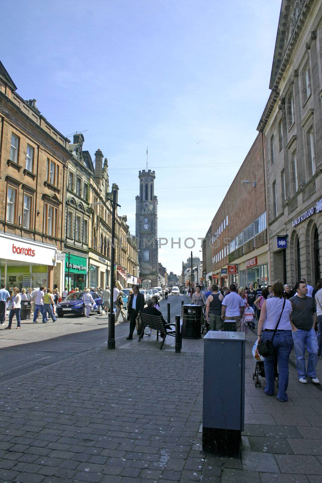Shoppers in a Car Lined Street Ayr Scotland