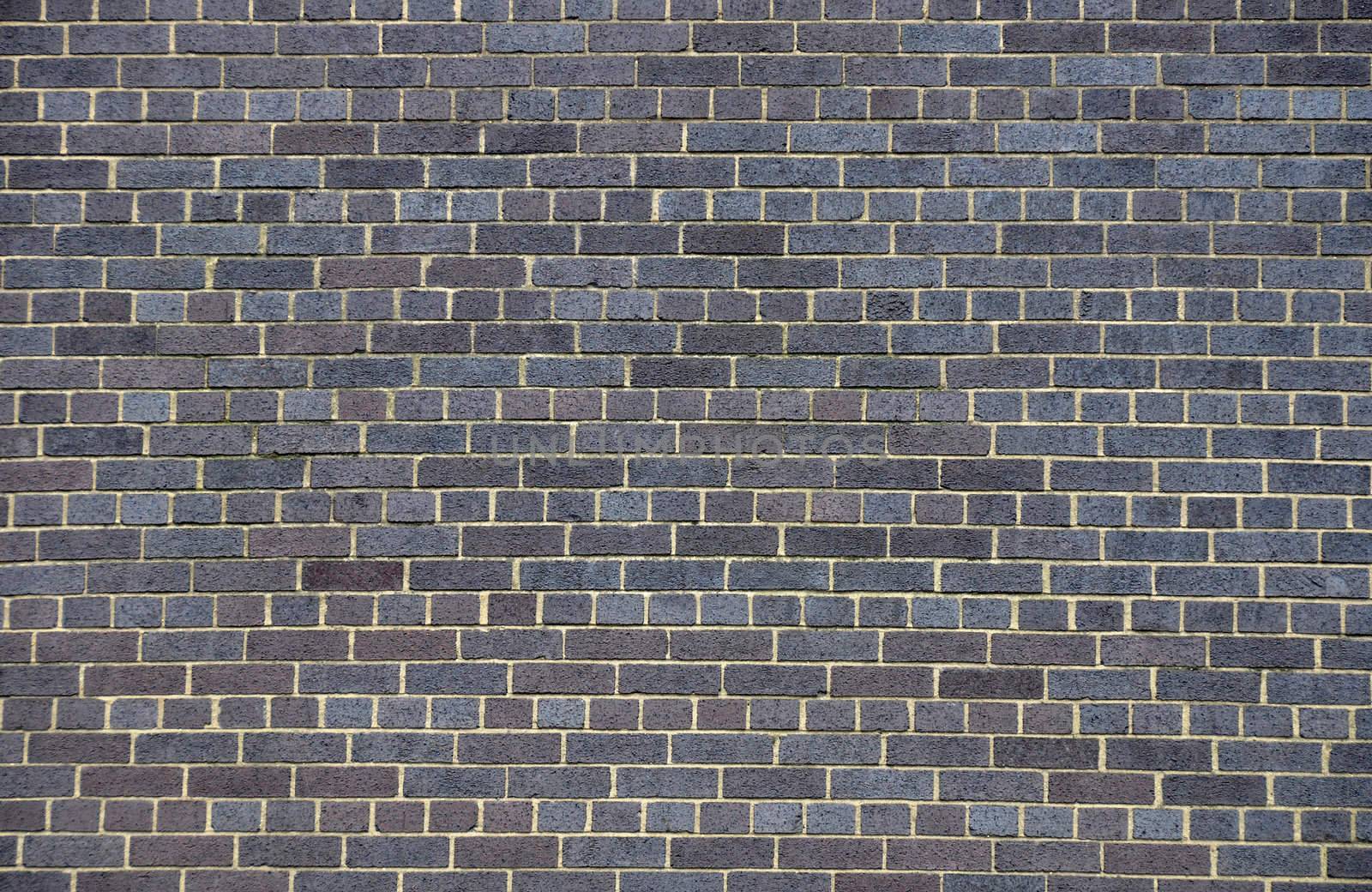 Dark brick wall by dutourdumonde