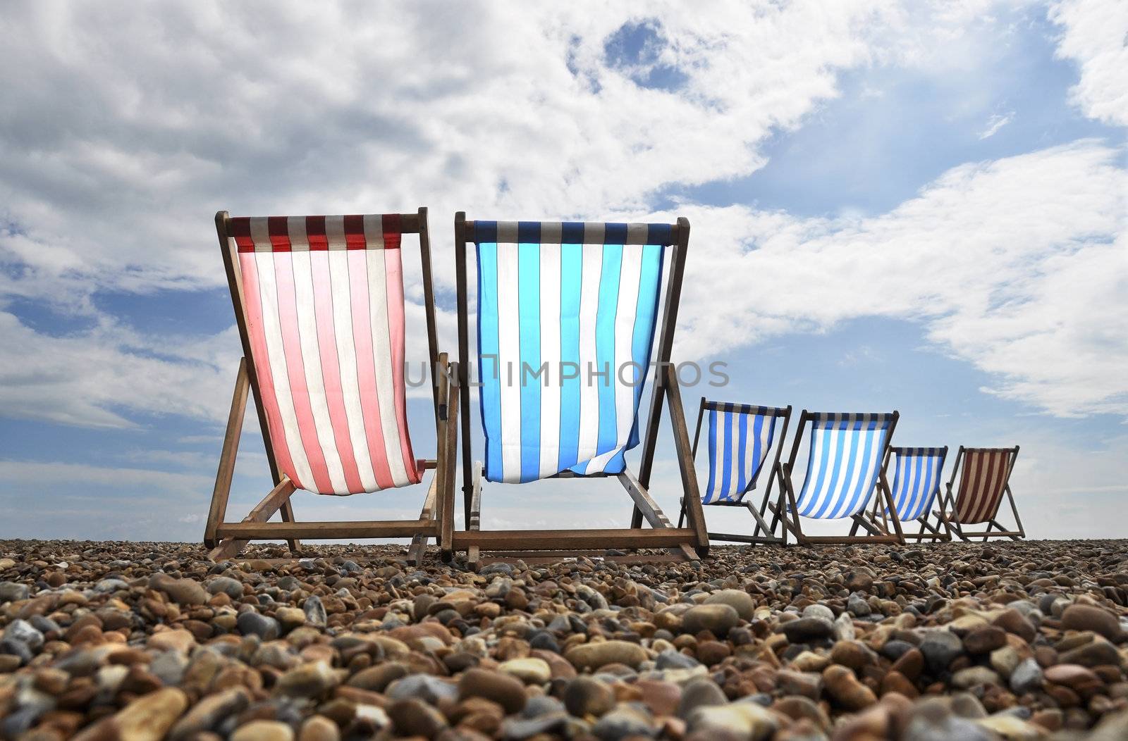 Empty deckchairs on brighton beach