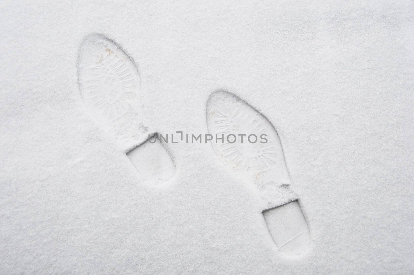 Footprint in the snow by dutourdumonde