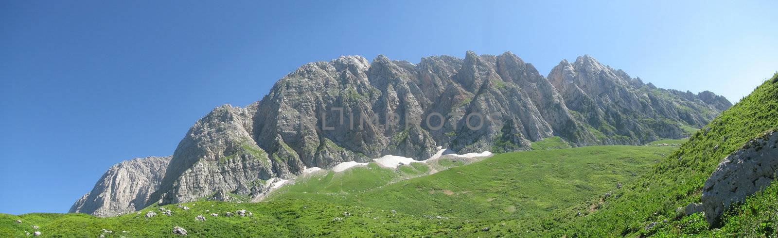 Mountains, rocks; a relief; a landscape; a hill; a panorama; Caucasus; top; a slope; clouds; the sky; a landscape