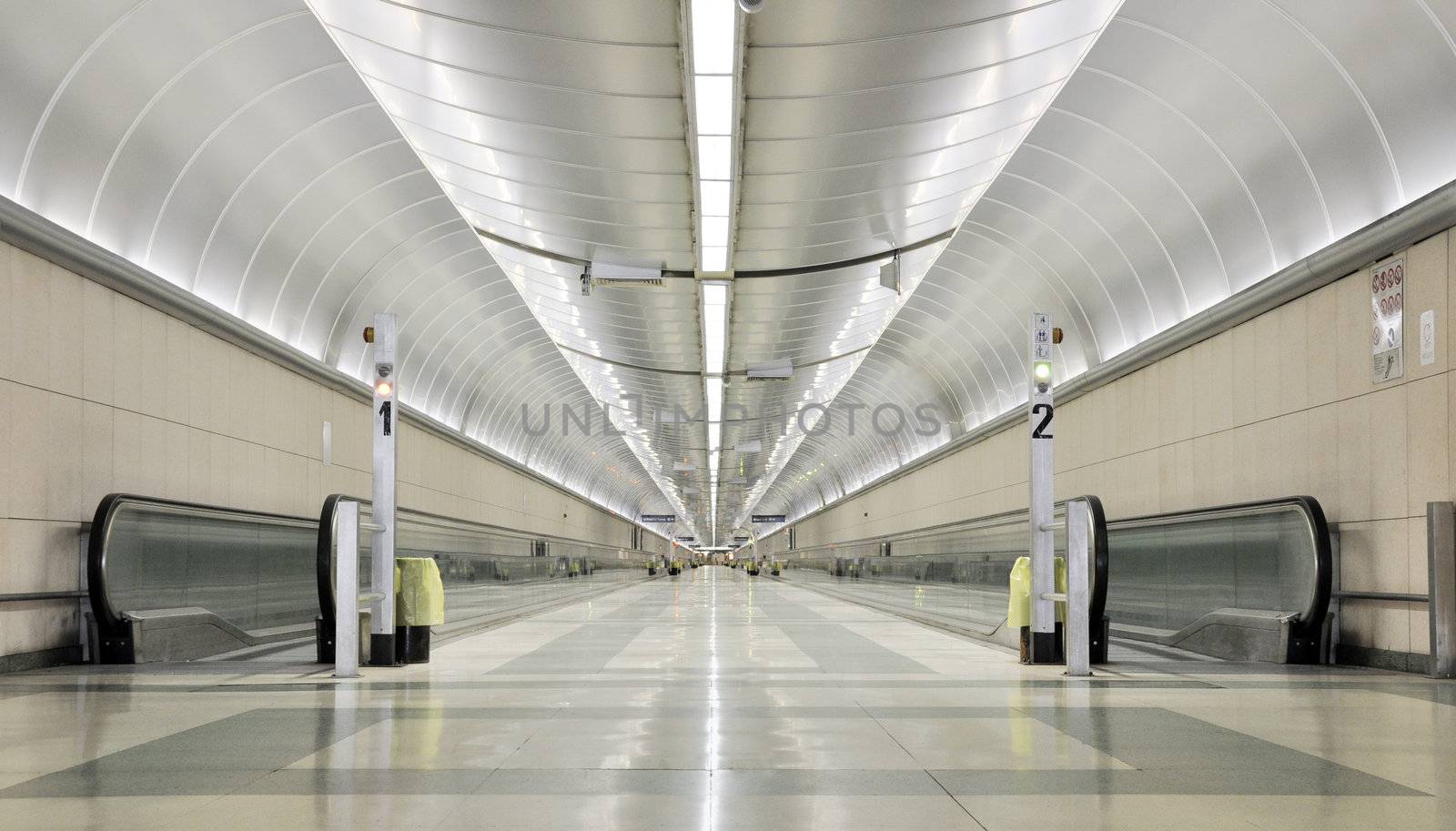 An endless and futuristic corridor in a train station