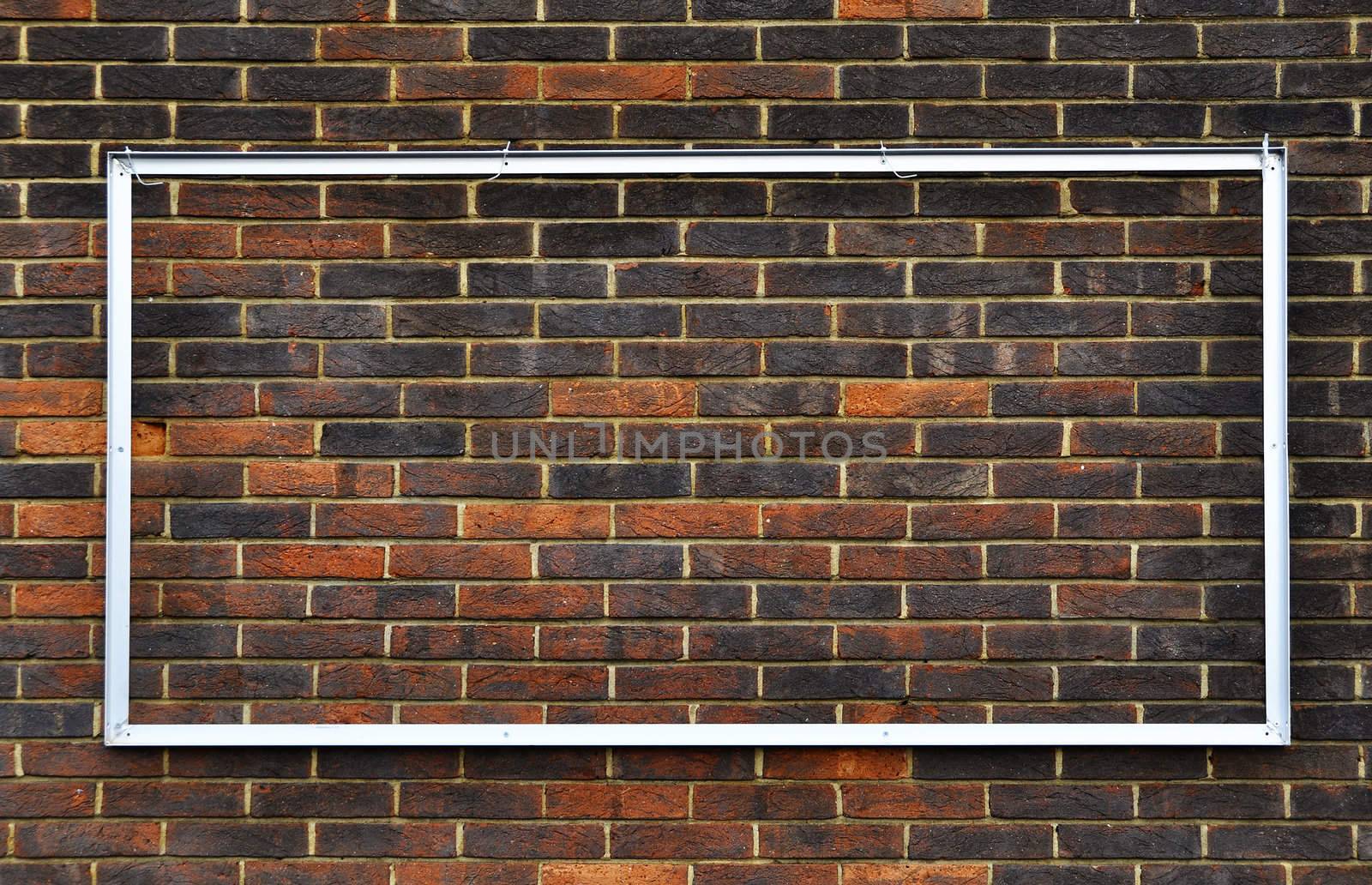 Rectangular frame on a brick wall