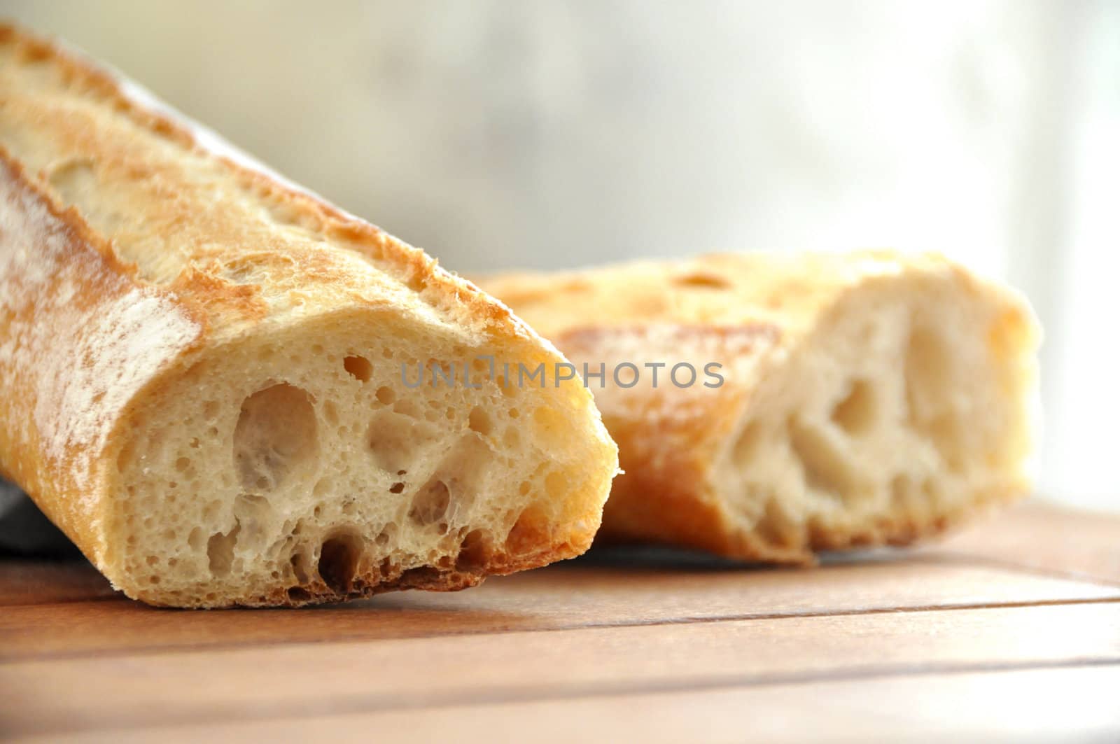 A traditional french loaf cut in two