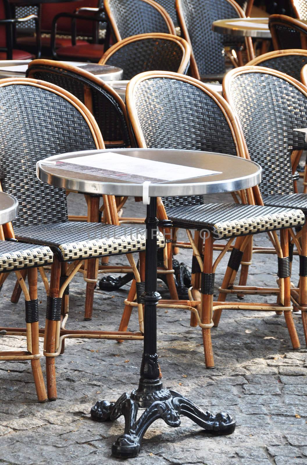 Parisian cafe terrace by dutourdumonde