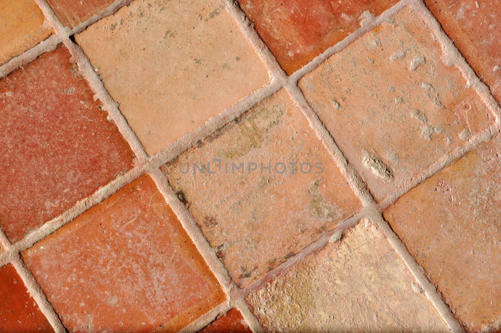 A nice and old traditional brown tile floor