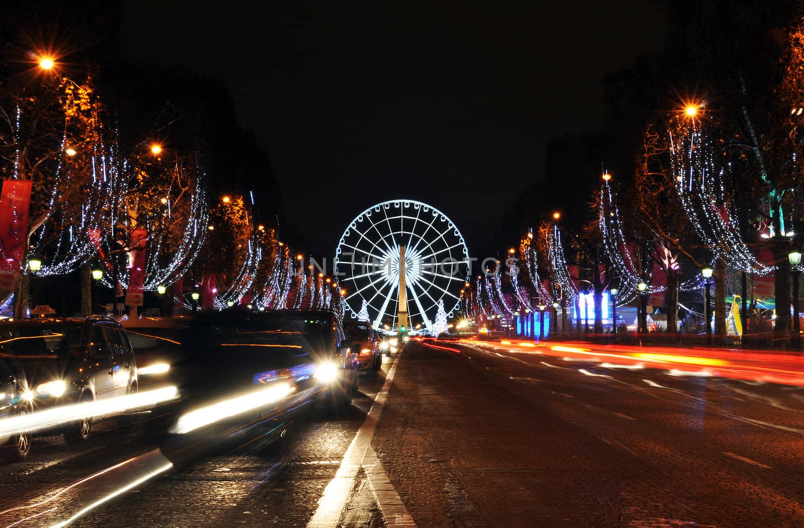 The Champs-Elysees avenue and the ferris wheel on Concorde Square illuminated for Christmas