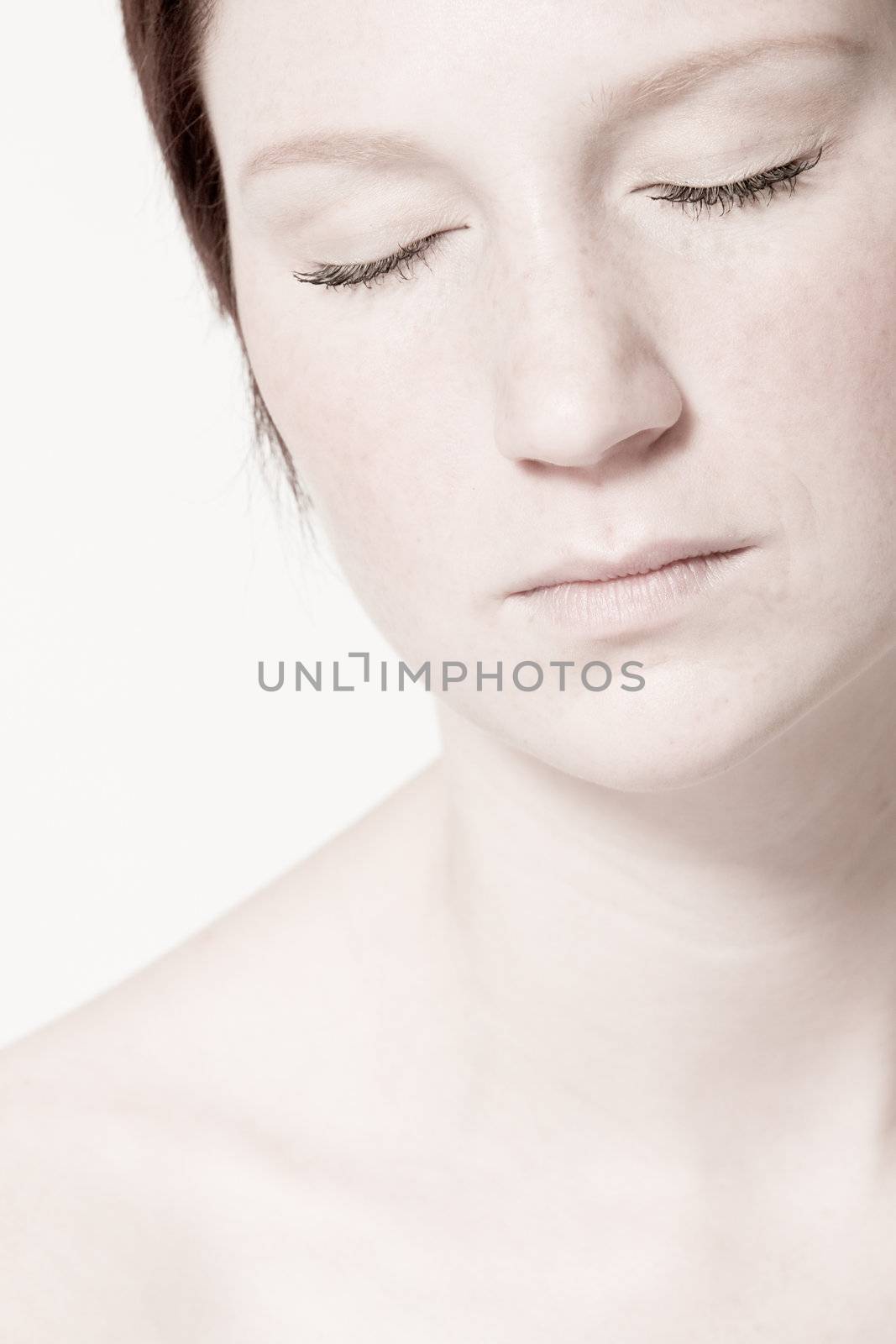 Studio portrait of a young woman with short hair relaxing by DNFStyle