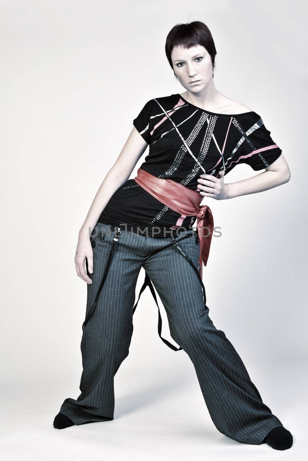 Studio portrait of a young woman with short hair looking fashionable