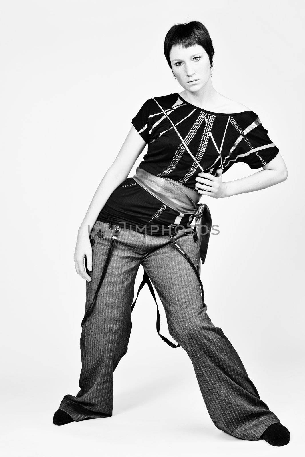 Studio portrait of a young woman with short hair looking fashionable