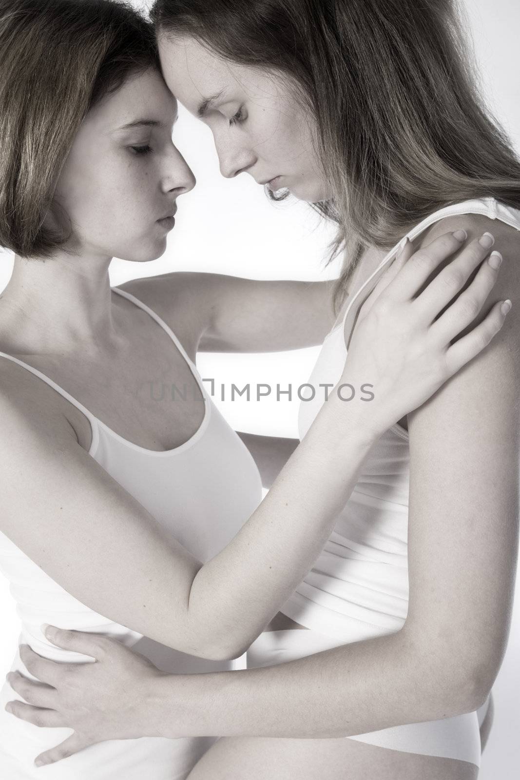 two beauty girlfriends in lingerie in the photo studio 