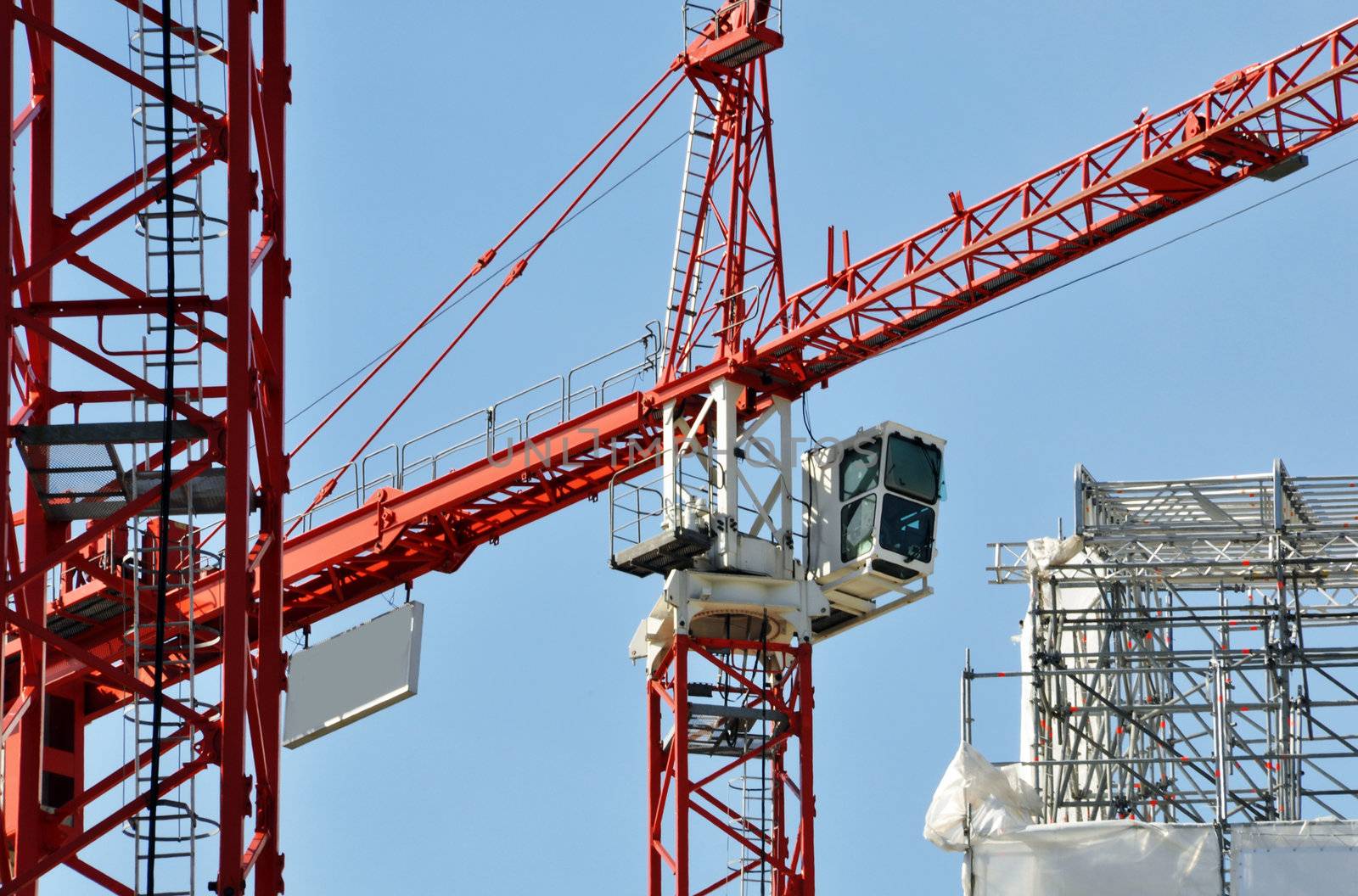 Cranes on a construction site by dutourdumonde