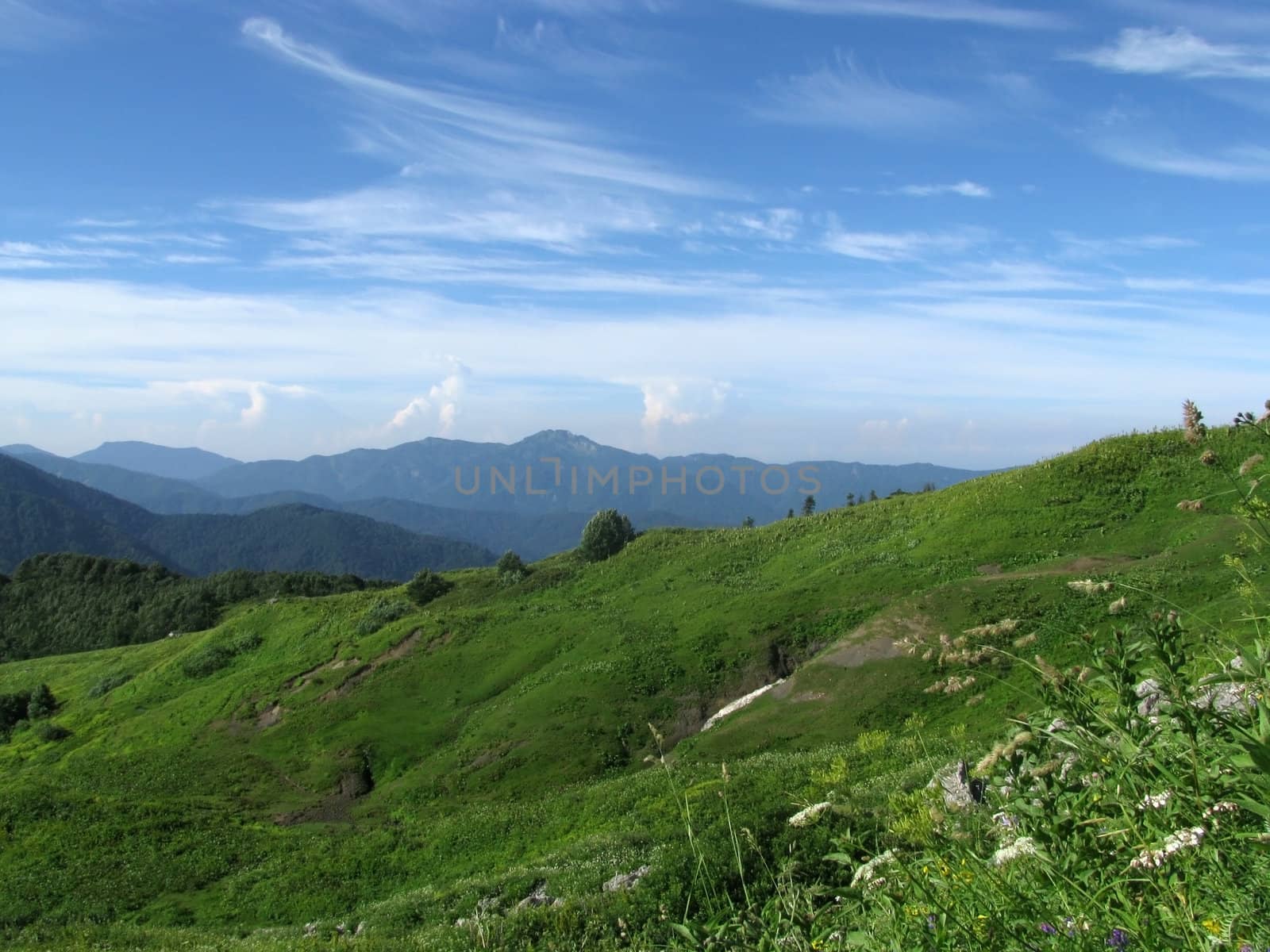 Mountains, rocks; a relief; a landscape; a hill; a panorama; Caucasus; top; a slope; clouds; the sky; a landscape; beauty