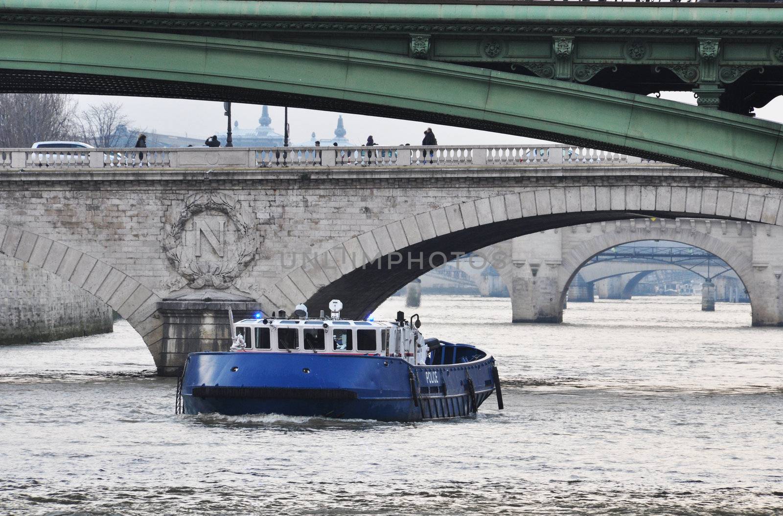 Police boat on the river Seine, Paris by dutourdumonde