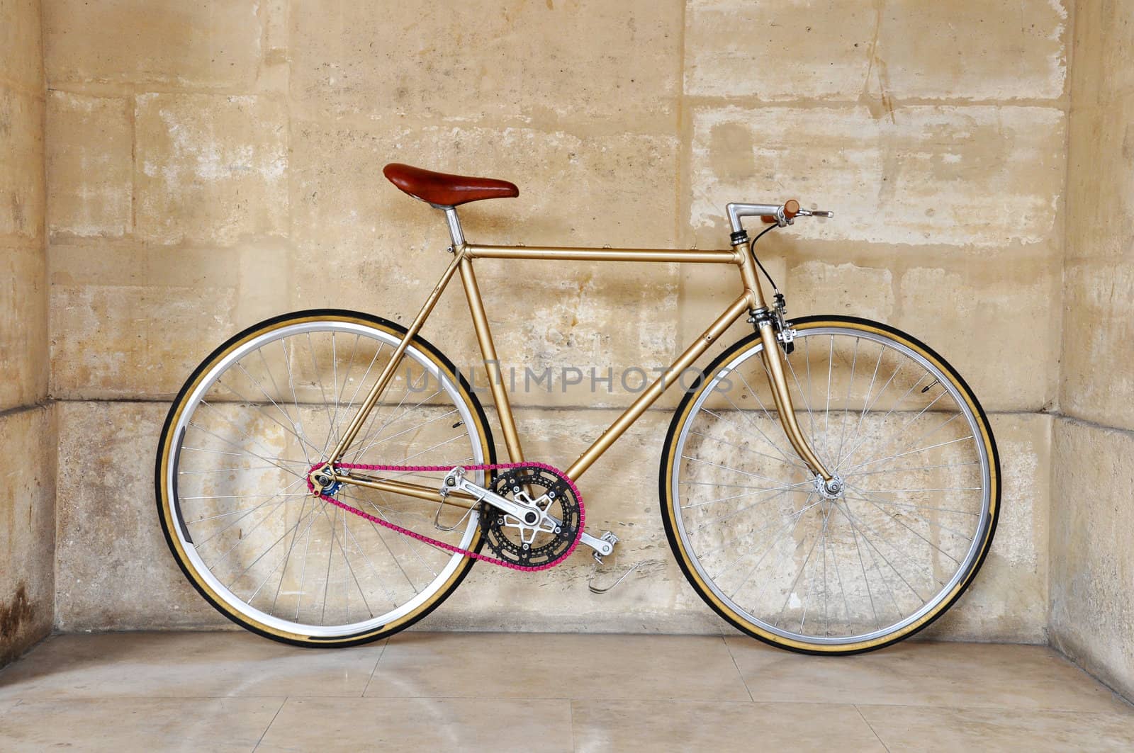 Vintage fixed gear bicycle with a pink chain