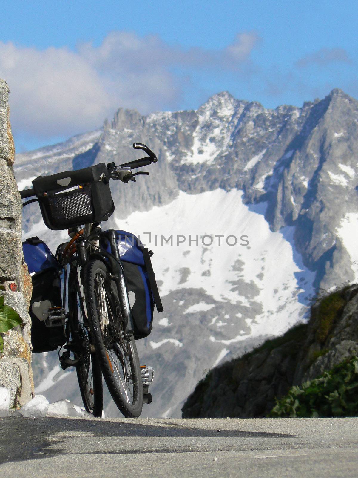 A loaded bicycle on the top of a pass in Switzerland