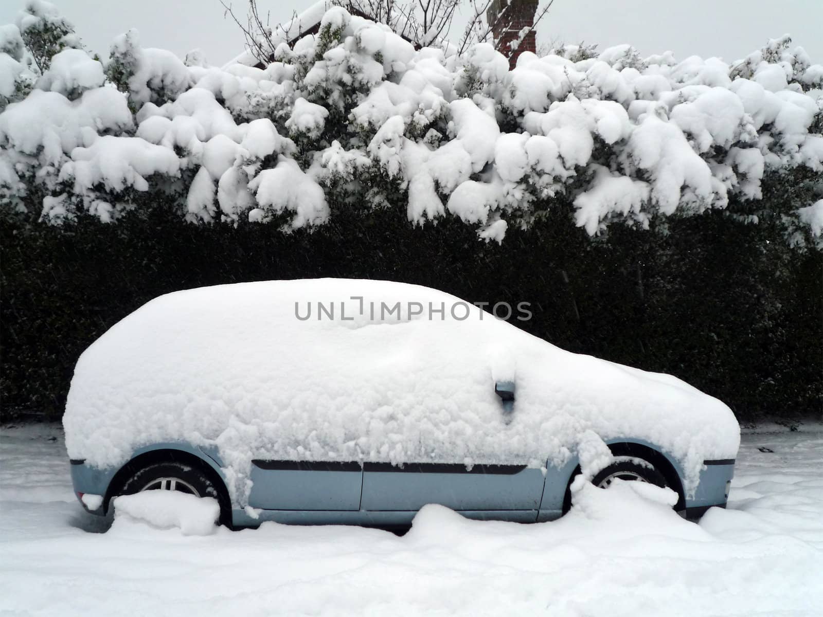 A car stuck in the snow during the winter season