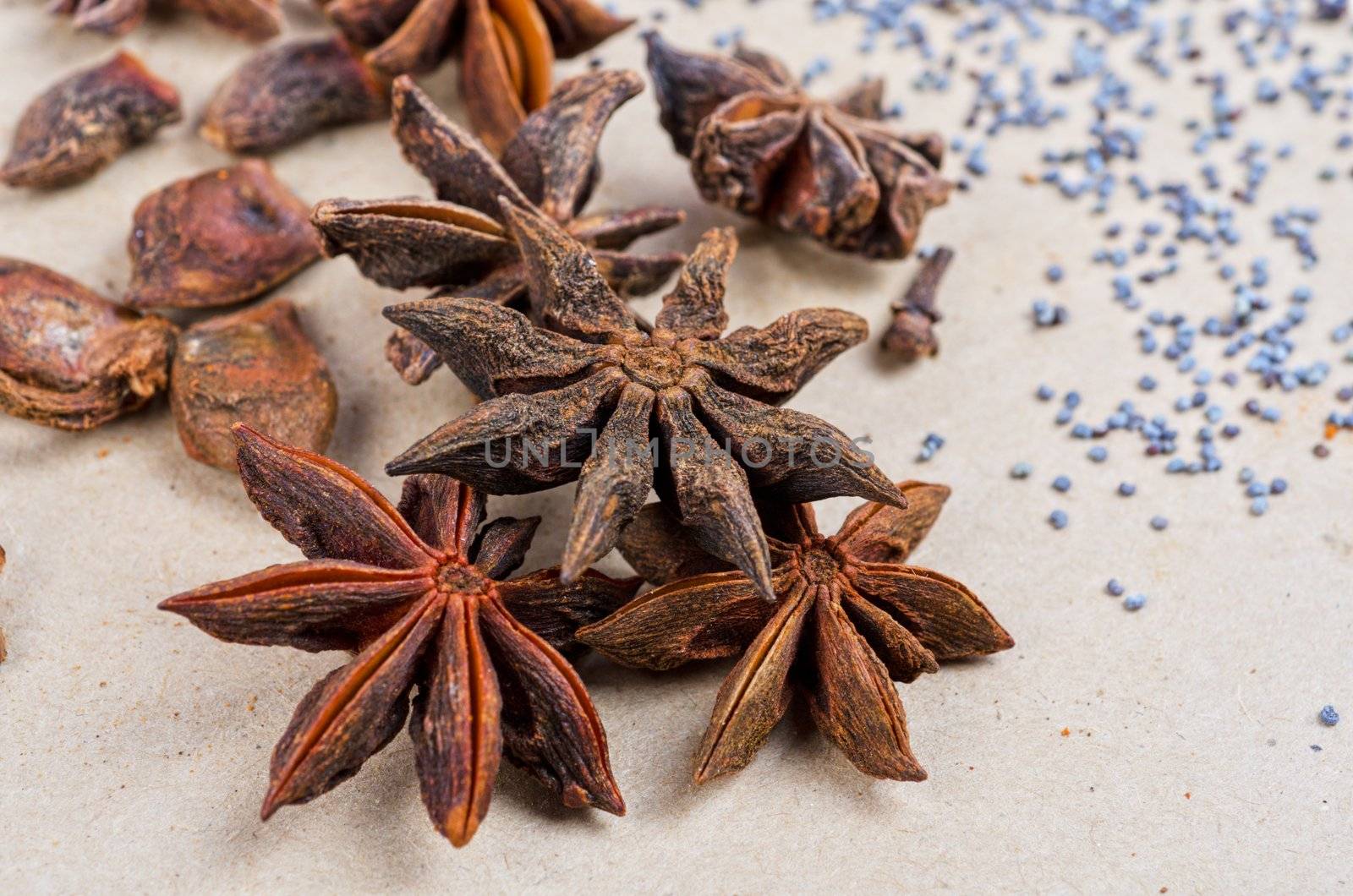 Anise stars close-up on a brown background