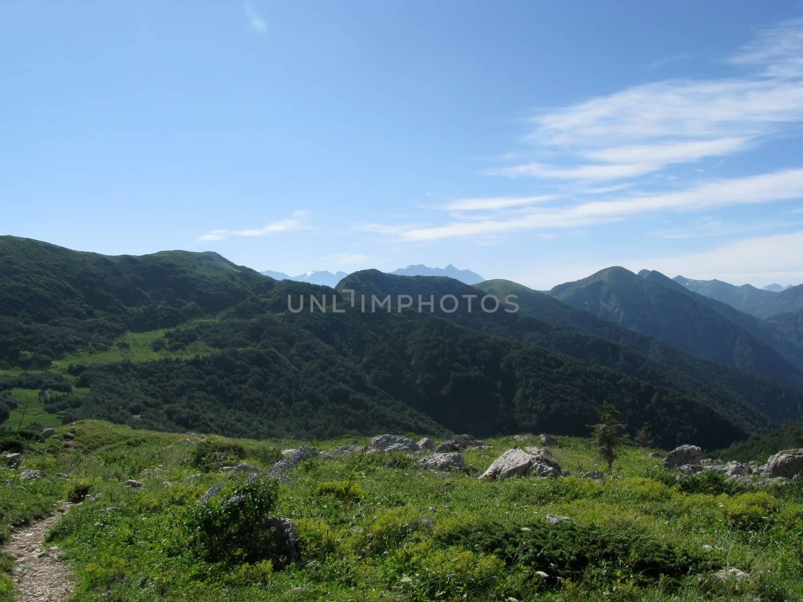 Mountains, rocks; a relief; a landscape; a hill; a panorama; Caucasus; top; a slope; clouds; the sky; a landscape