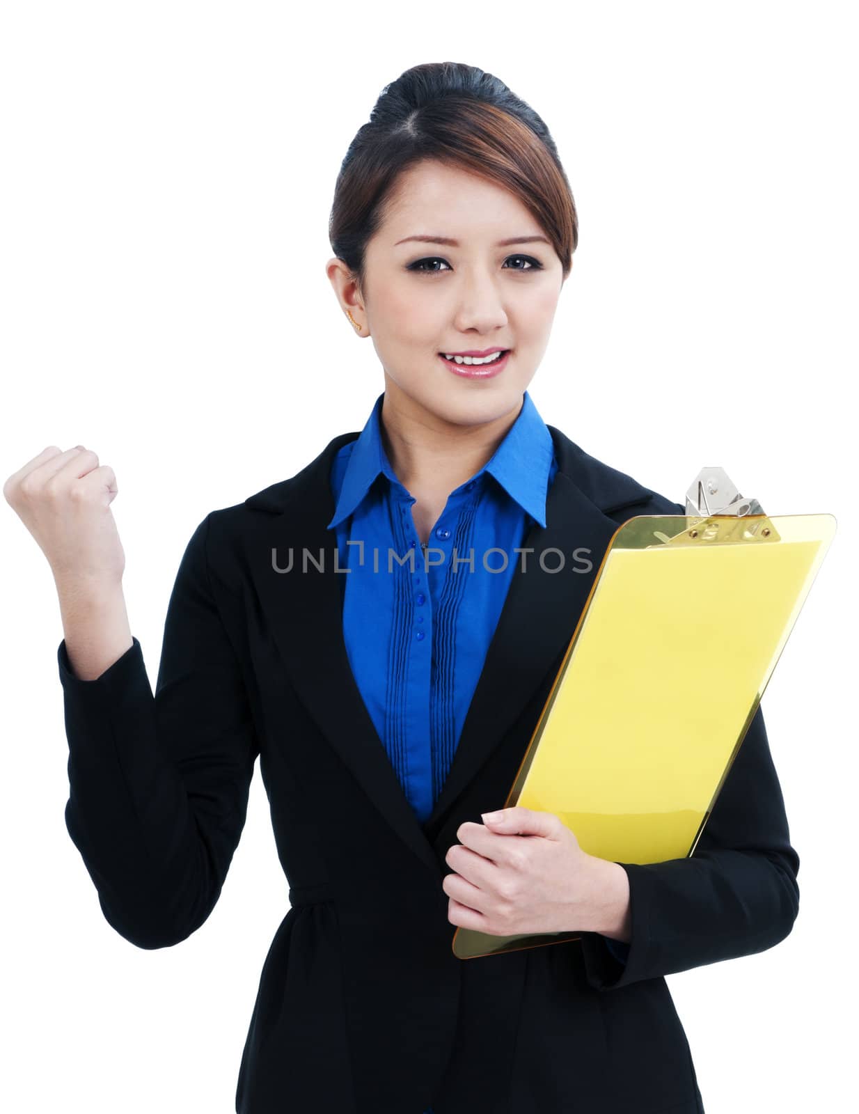 Portrait of a beautiful young businesswoman clenching her fist and holding clipboard, isolated on white background.