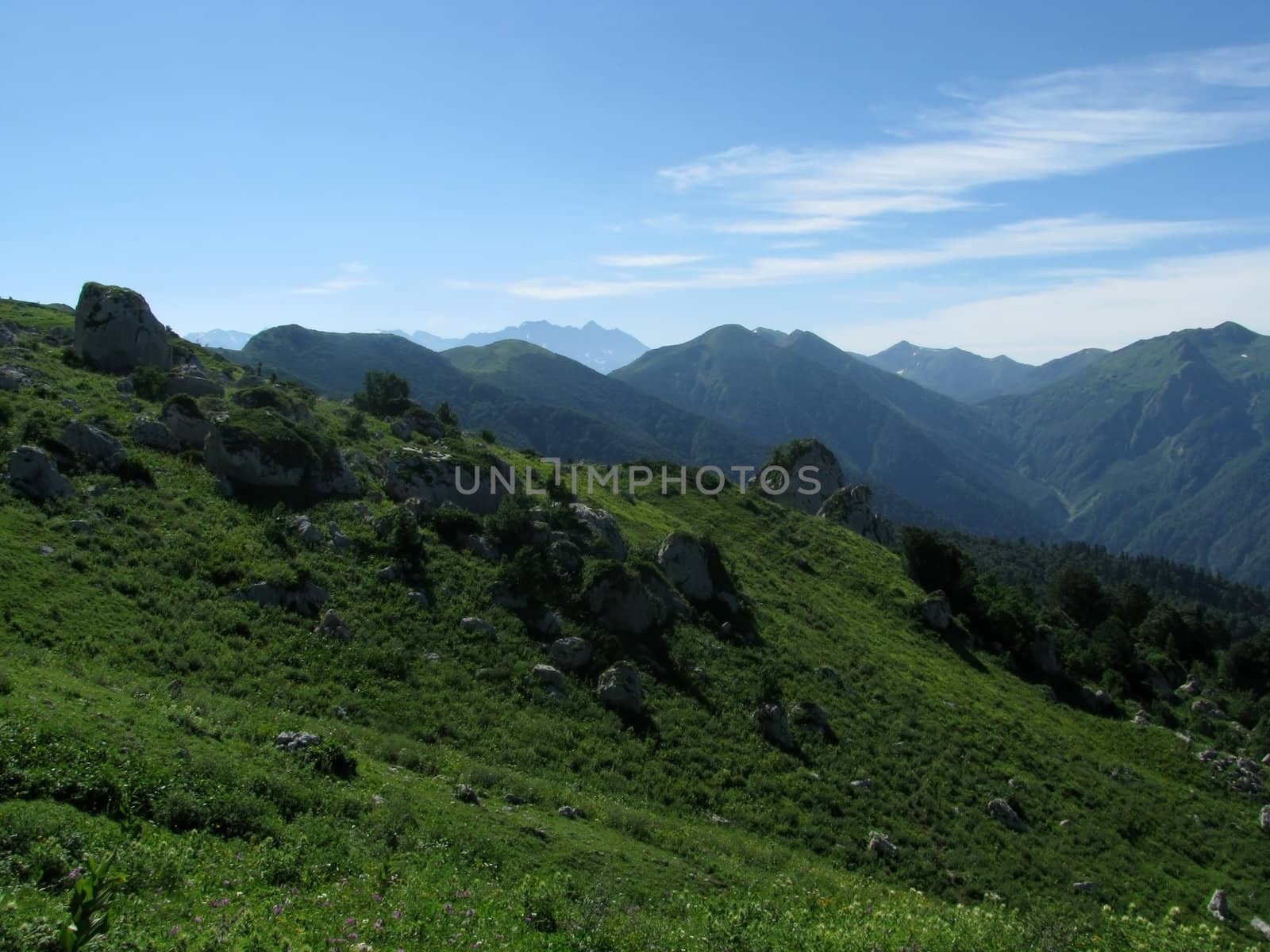 Mountains, rocks; a relief; a landscape; a hill; a panorama; Caucasus; top; a slope; clouds; the sky; a landscape