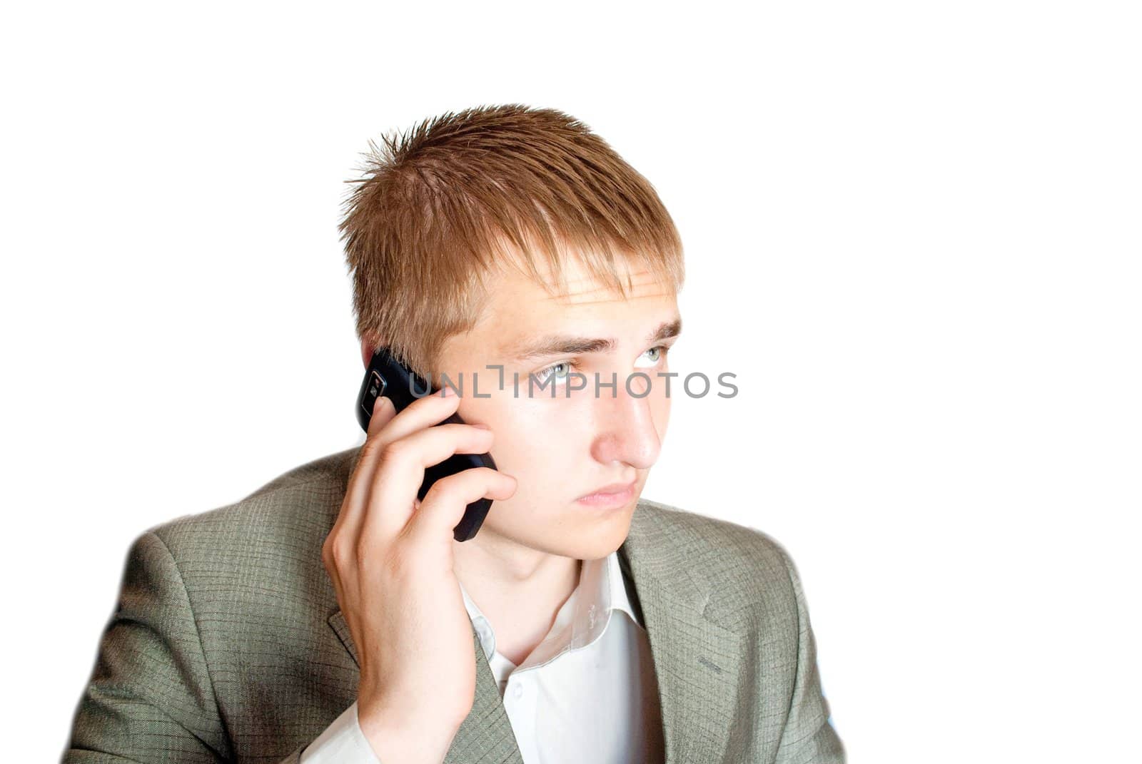 A handsome young businessman with phone by Diversphoto