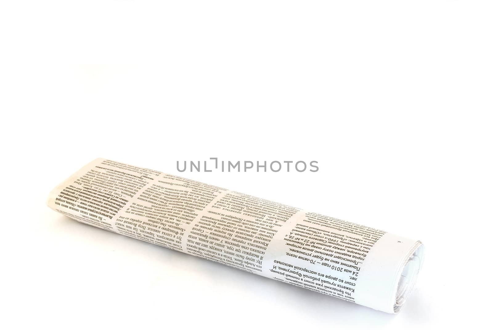 rolled up newspaper on white background